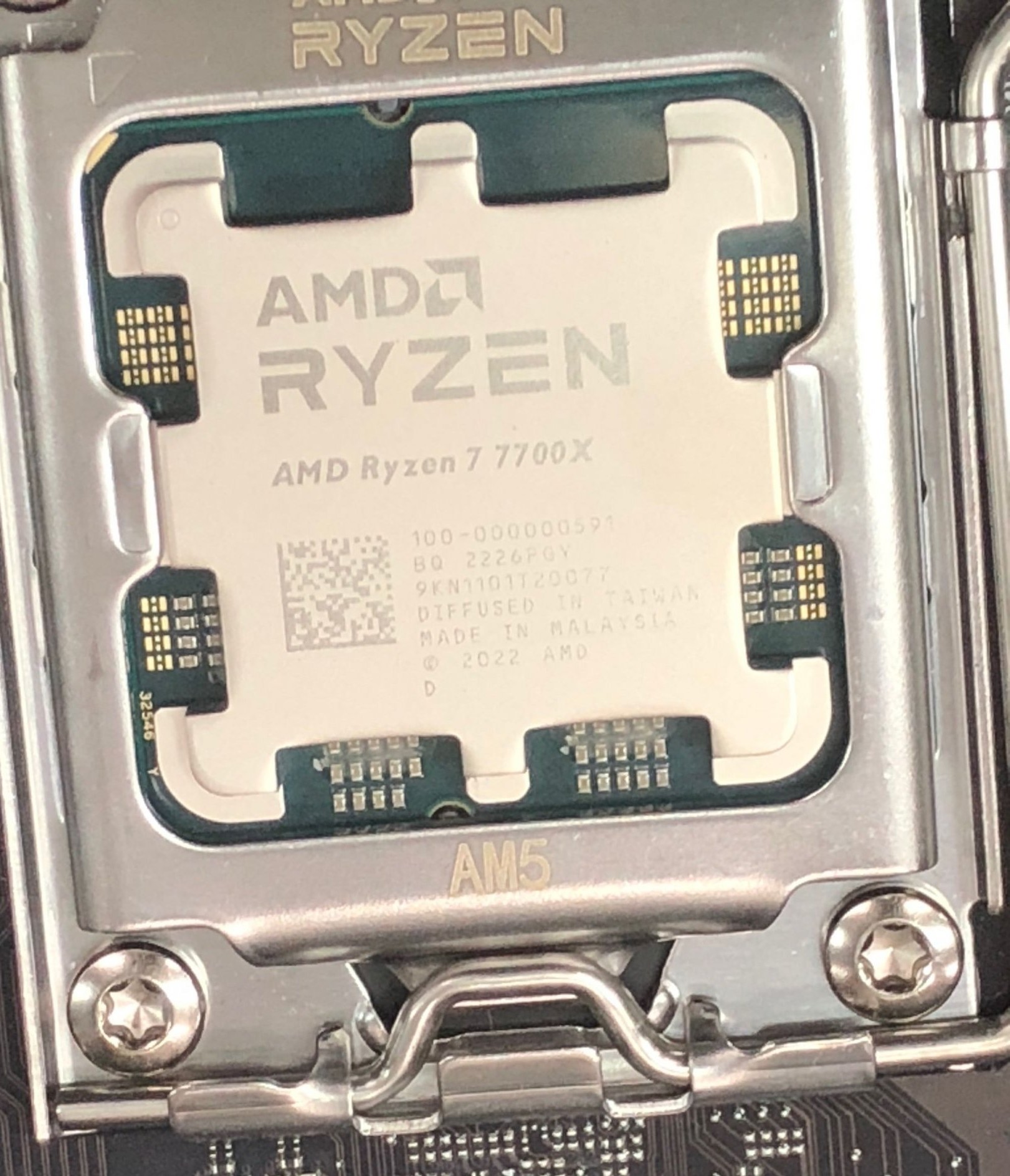 AMD Ryzen 7 7700X Zen4 CPU pictured up close - VideoCardz.com